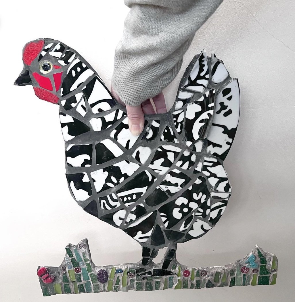 Mosaic hen in black and white patterned ceramics