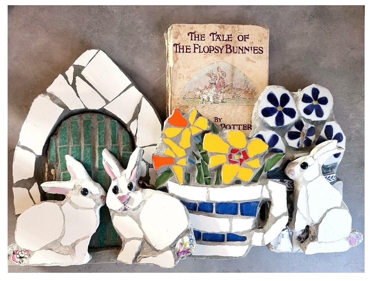 Mosaic rabbits arranged around a vintage Beatrix Potter Flopsy Bunnies book
