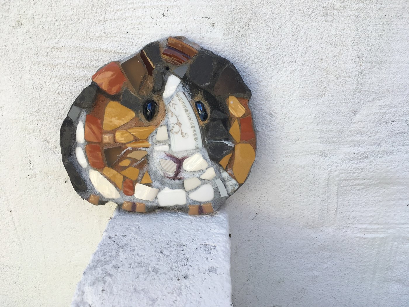 Mosaic guinea pig made from broken patterned china
