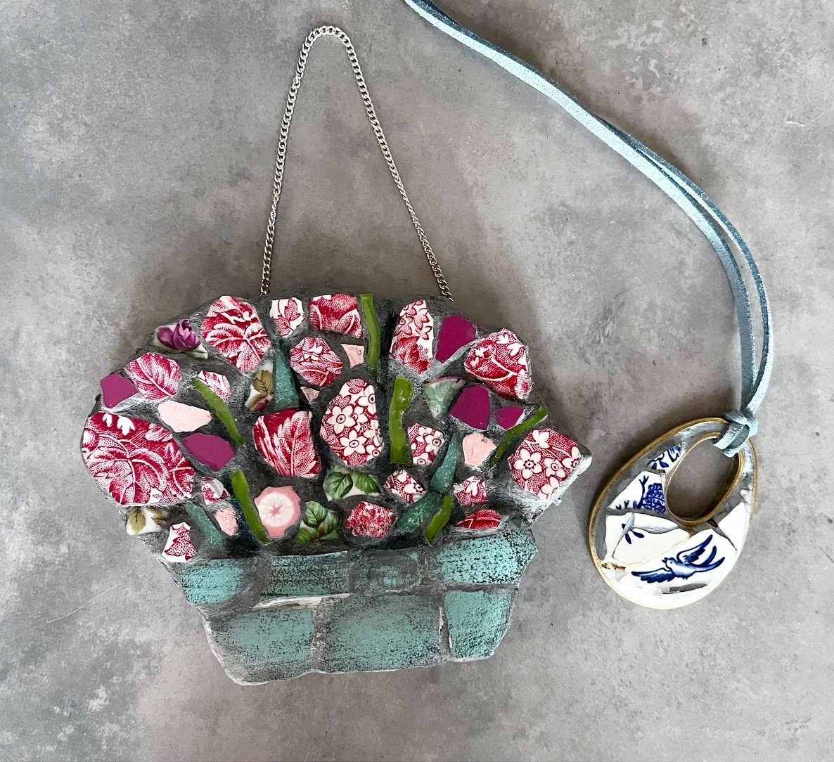 Mosaic hanging basket of flowers with a small willow-pattern pendant